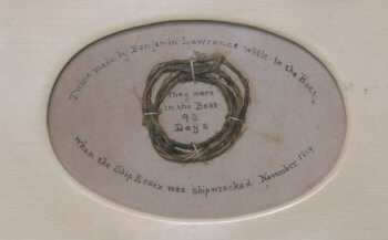 Framed small piece of twine with attribution to Benjamin Lawrence.